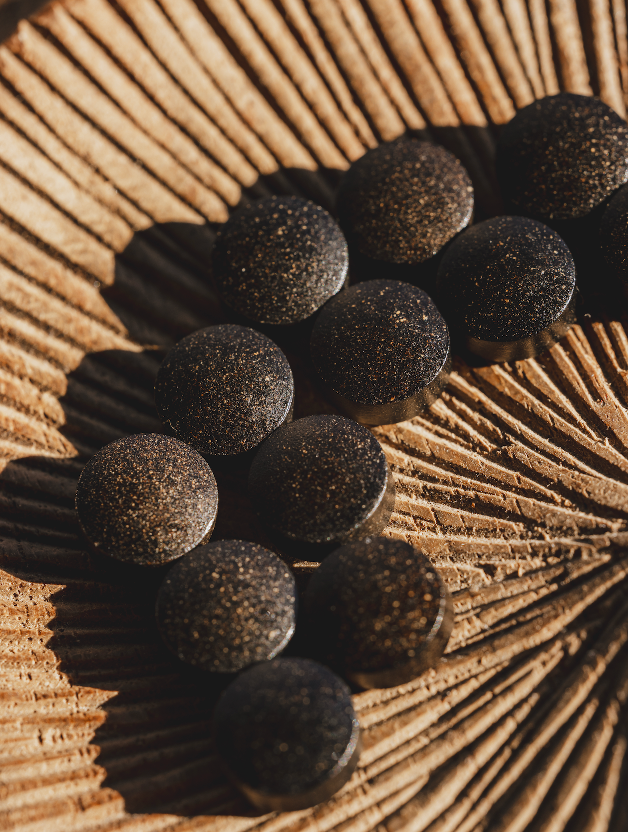 Meru shilajit tablets Himalayan peppermint mineral supplement gummy close-up detail by Hermetica Superfoods