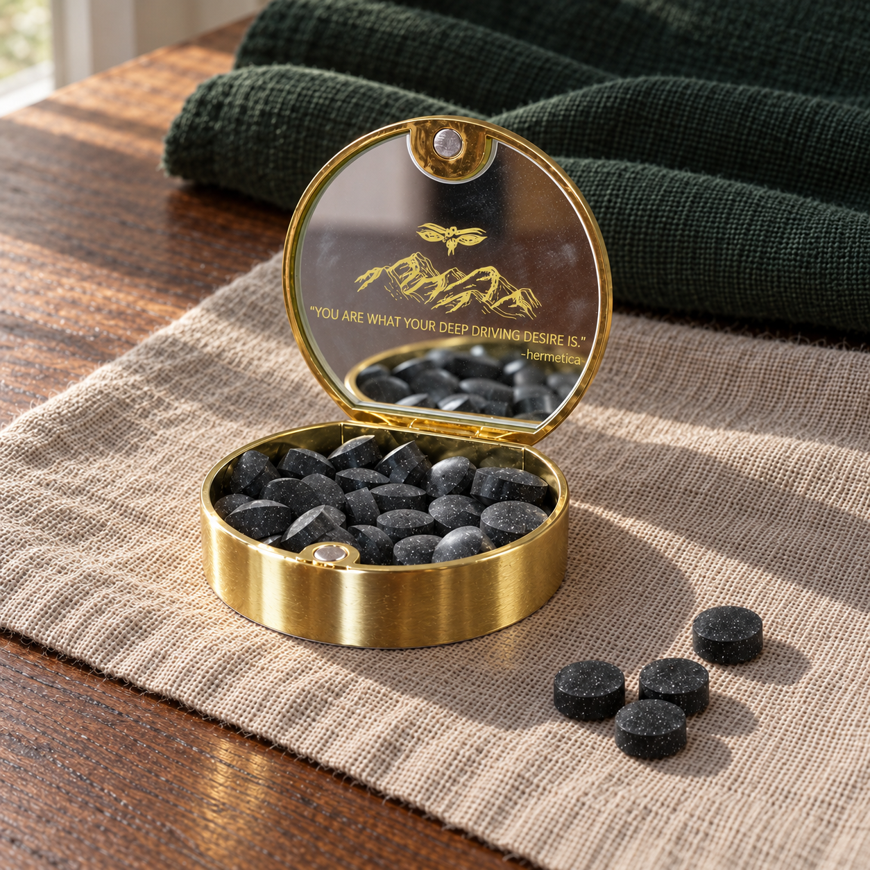 Open Meru gold compact with dark shilajit tablets