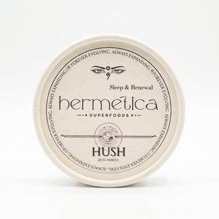 Overhead shot of a round Hermetica Hush low-dose melatonin sleep gummies container on a white background.