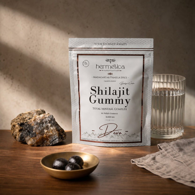 Deva Shilajit Gummies pouch in a sunrise mineral ritual on walnut