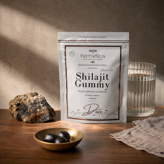 Deva Shilajit Gummies pouch in a sunrise mineral ritual on walnut