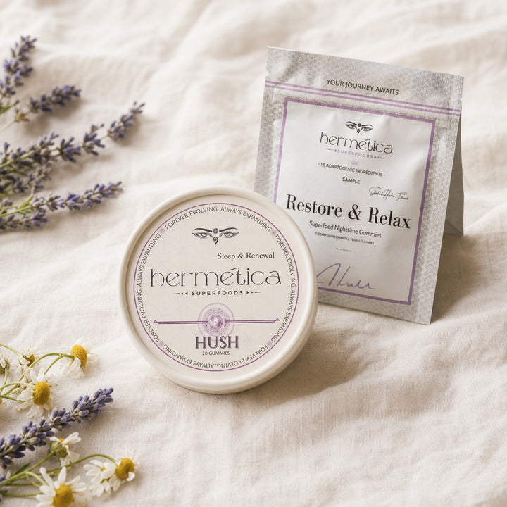 Hush Sleep Gummies tin beside the Sleep and Restore sample packet on ivory linen