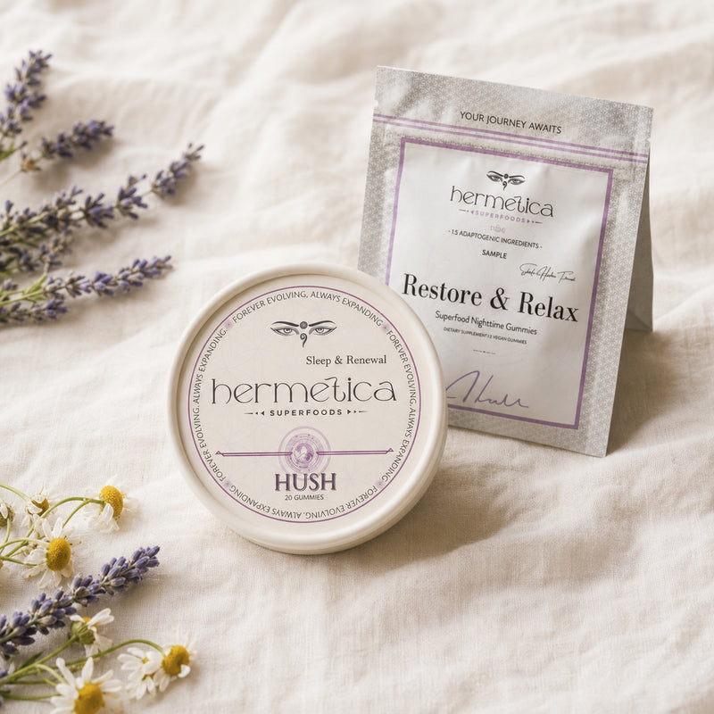 Hush Sleep Gummies tin beside the Sleep and Restore sample packet on ivory linen