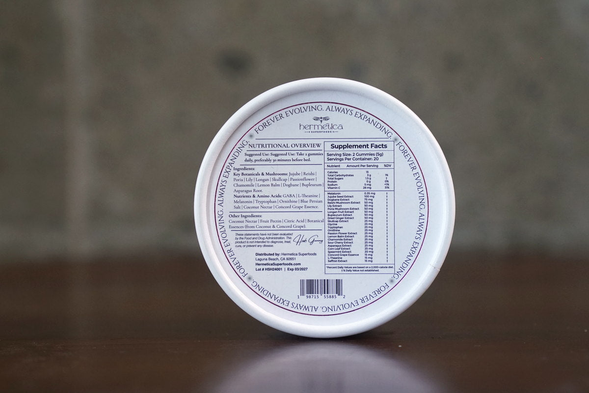 Hush Sleep Gummies tin on a bedside table