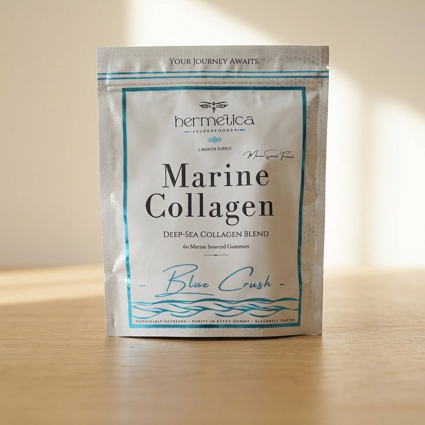 Blue Crush Marine Collagen pouch on marble with blue-violet collagen gummies spilled in front