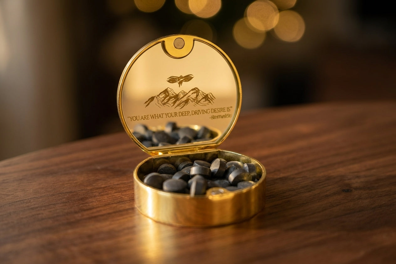 Meru gold tin open on walnut showing tablets and its mirrored lid