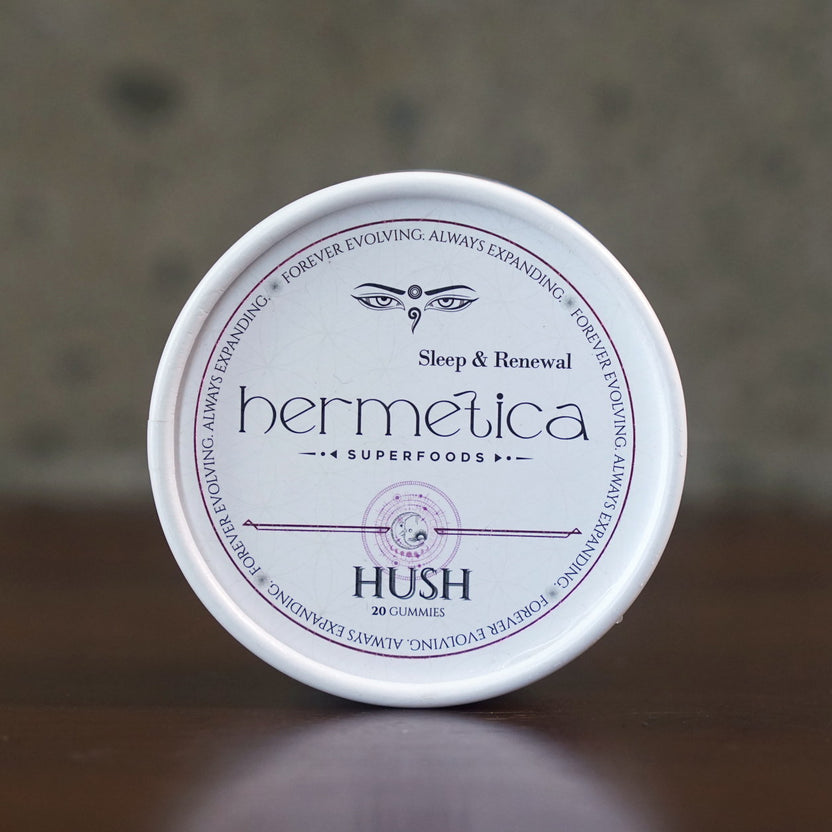 Hush Sleep Gummies tin photographed straight on, showing the full Sleep and Renewal label