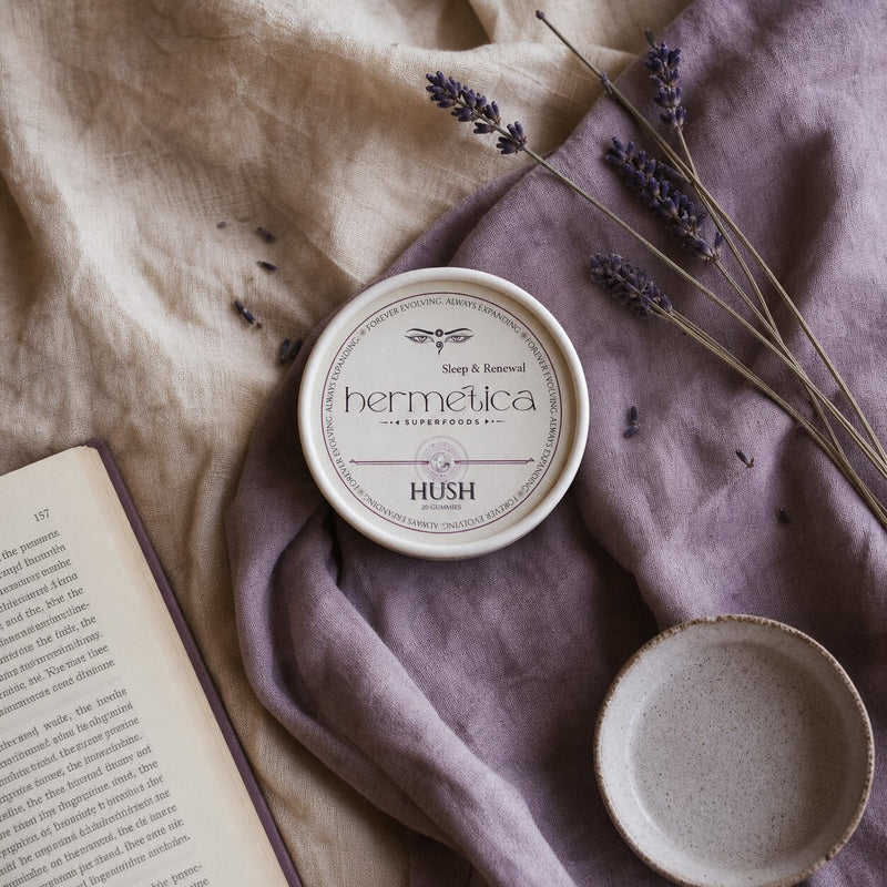 Hush beside an open book and evening cup in a quiet wind-down ritual