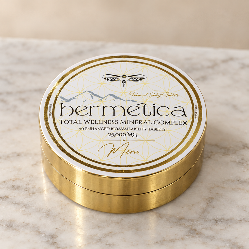Meru closed gold compact on a limestone tabletop