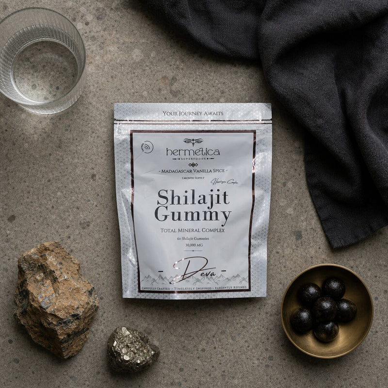 Deva pouch and gummies in a detailed mineral flat lay