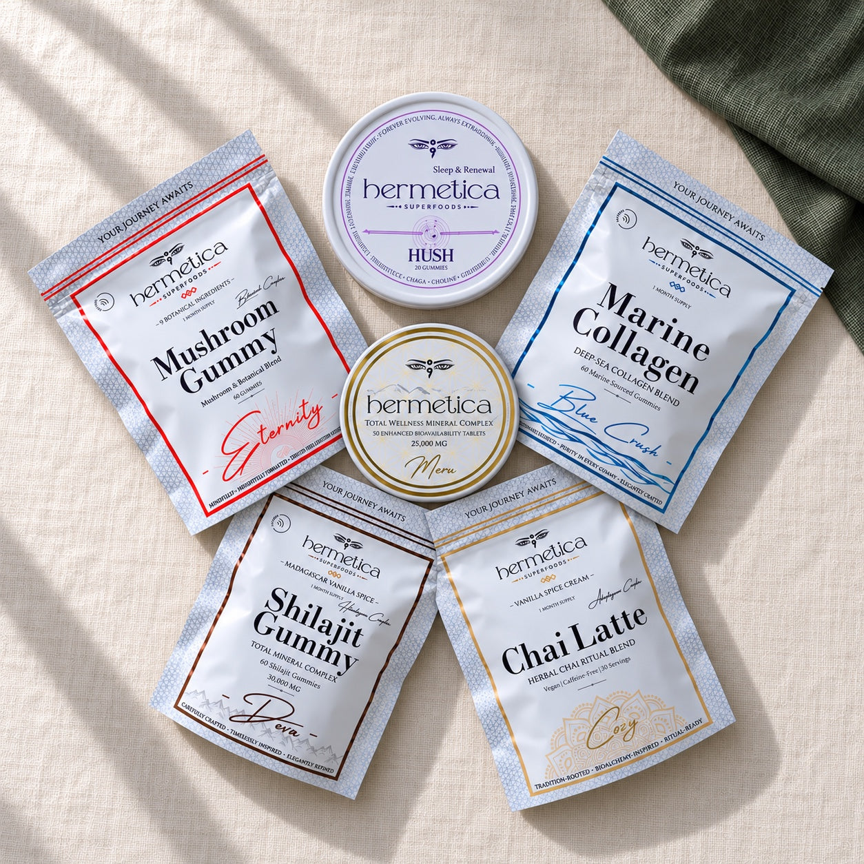 All six full-size Hermetica formulas arranged around Meru: Hush, Eternity, Deva, Blue Crush, Cozy and Meru