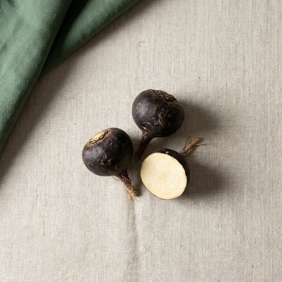 Black maca roots, one sliced