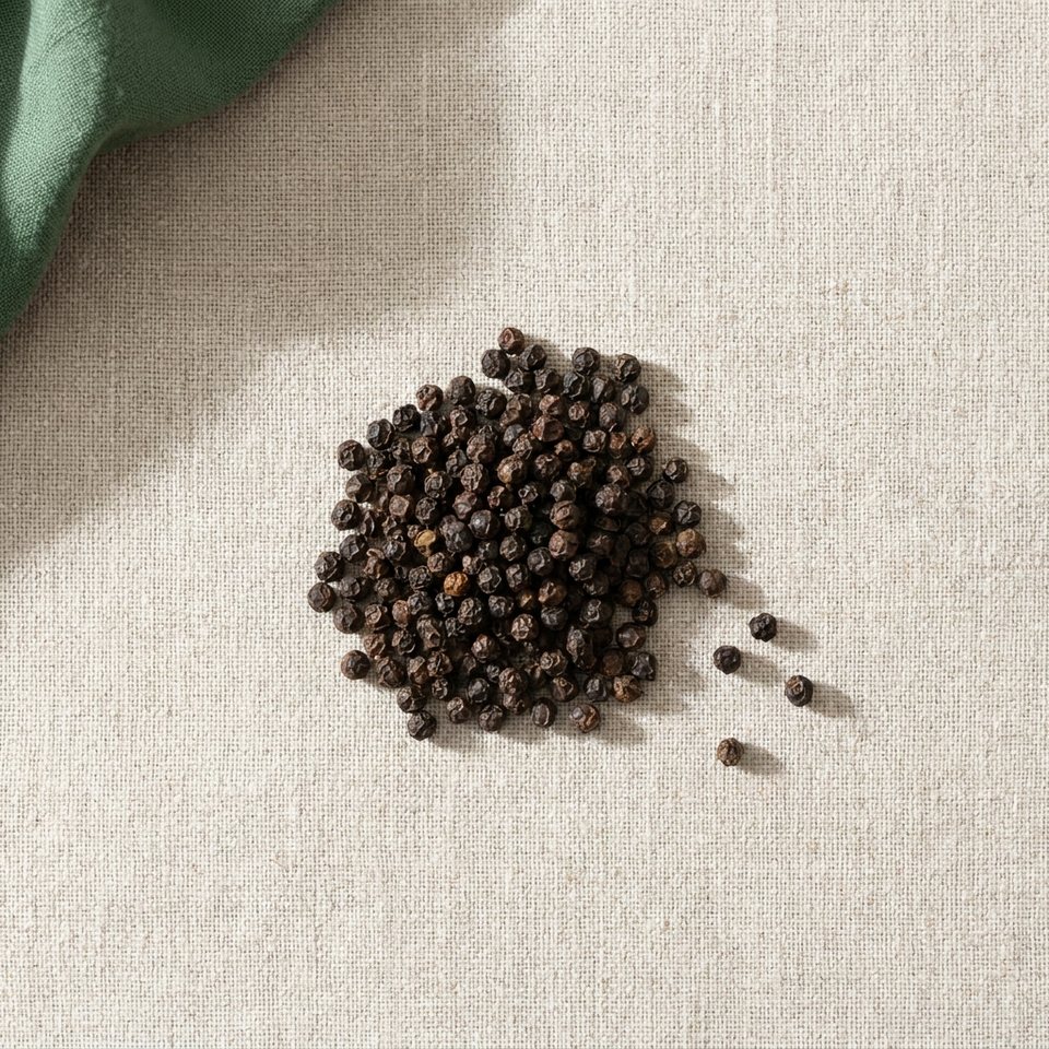 Whole black peppercorns