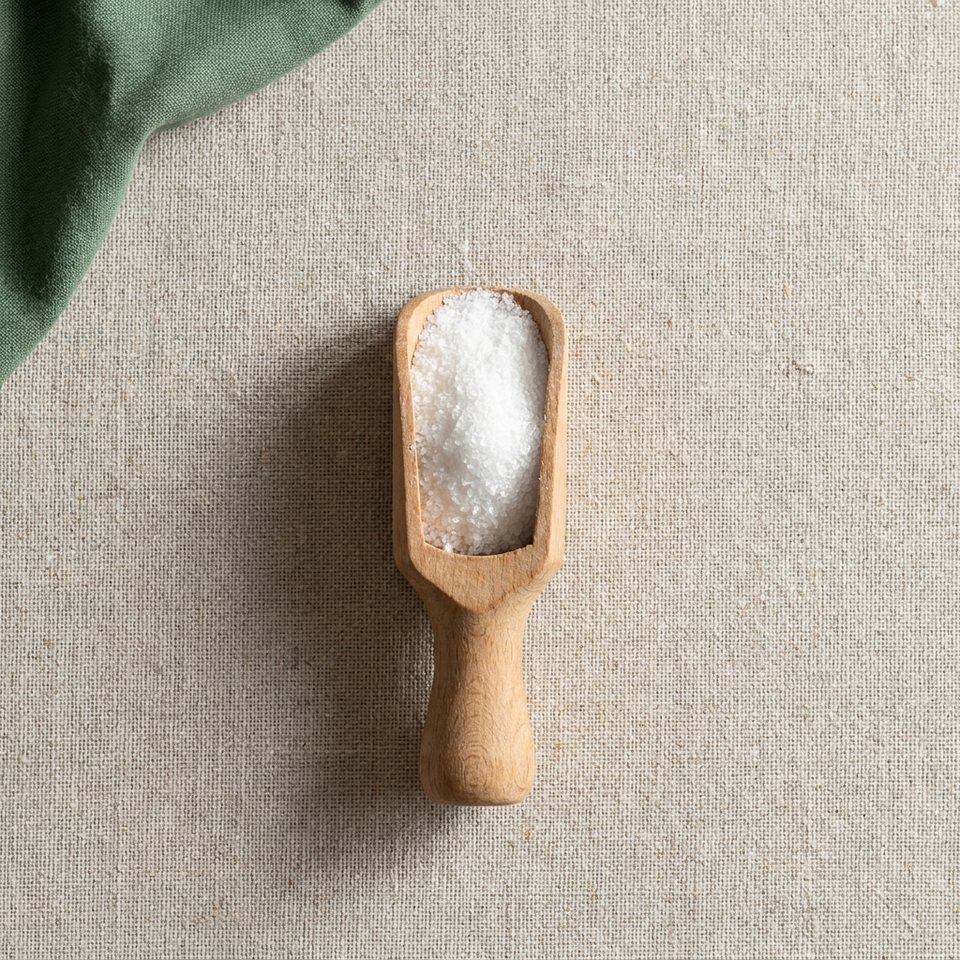 Ornithine powder in a wooden scoop