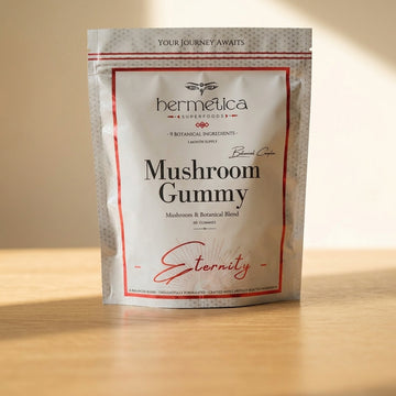Eternity Mushroom Gummies pouch on a wooden shelf beside dried mushrooms and reishi