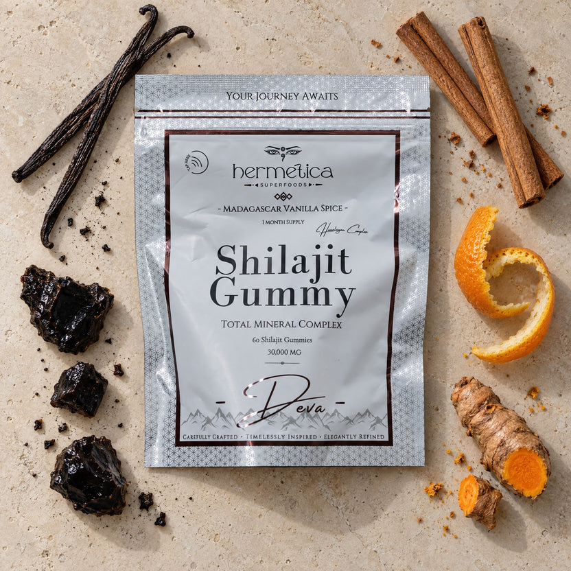 Deva pouch seen from above on pale stone with shilajit resin, vanilla, cinnamon, orange peel and turmeric