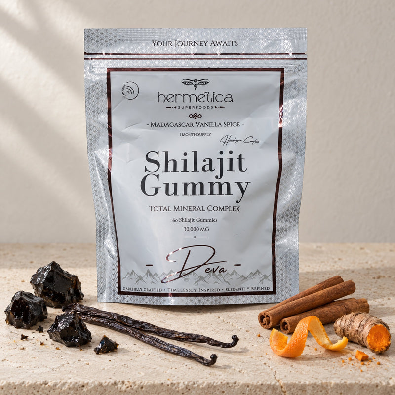 Deva pouch on pale stone with shilajit resin, vanilla, cinnamon, orange peel and turmeric