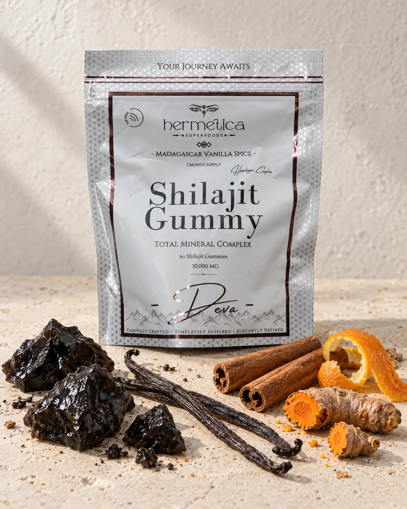 Deva pouch with shilajit resin, vanilla, cinnamon, orange peel and turmeric heaped around it