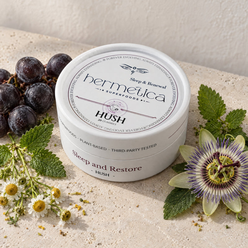 Hush tin on pale stone with Concord grapes, chamomile, lemon balm and passionflower